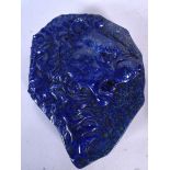 A LARGE LAPIS LAZULI PLAQUE, boldly carved with the face of a lion, boxed. 19.5 cm x 14.5 cm.