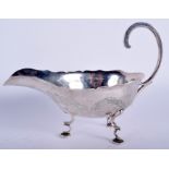 A LATE 19TH CENTURY CHINESE EXPORT SILVER SAUCE BOAT engraved with dragons. 163 grams. 16 cm wide.