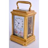 A LOVELY MINIATURE FRENCH SEVRES PORCELAIN CARRIAGE CLOCK painted with lovers within landscapes. 8.