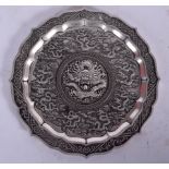 A 20TH CENTURY CHINESE WHITE METAL DISH, decorated with dragons. 11.5 cm wide.