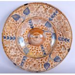 A 16TH CENTURY HISPANO MORESQUE LUSTRE CHARGER C1550, probably Valencia, painted with flowers. 32 c
