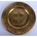 A SMALL 19TH CENTURY ISLAMIC MIDDLE EASTERN BRASS DISH decorated with floral sprays. 15 cm diameter