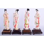 A SET OF FOUR EARLY 20TH CENTURY CHINESE POLYCHROMED IVORY FIGURES painted with gilt motifs and flo