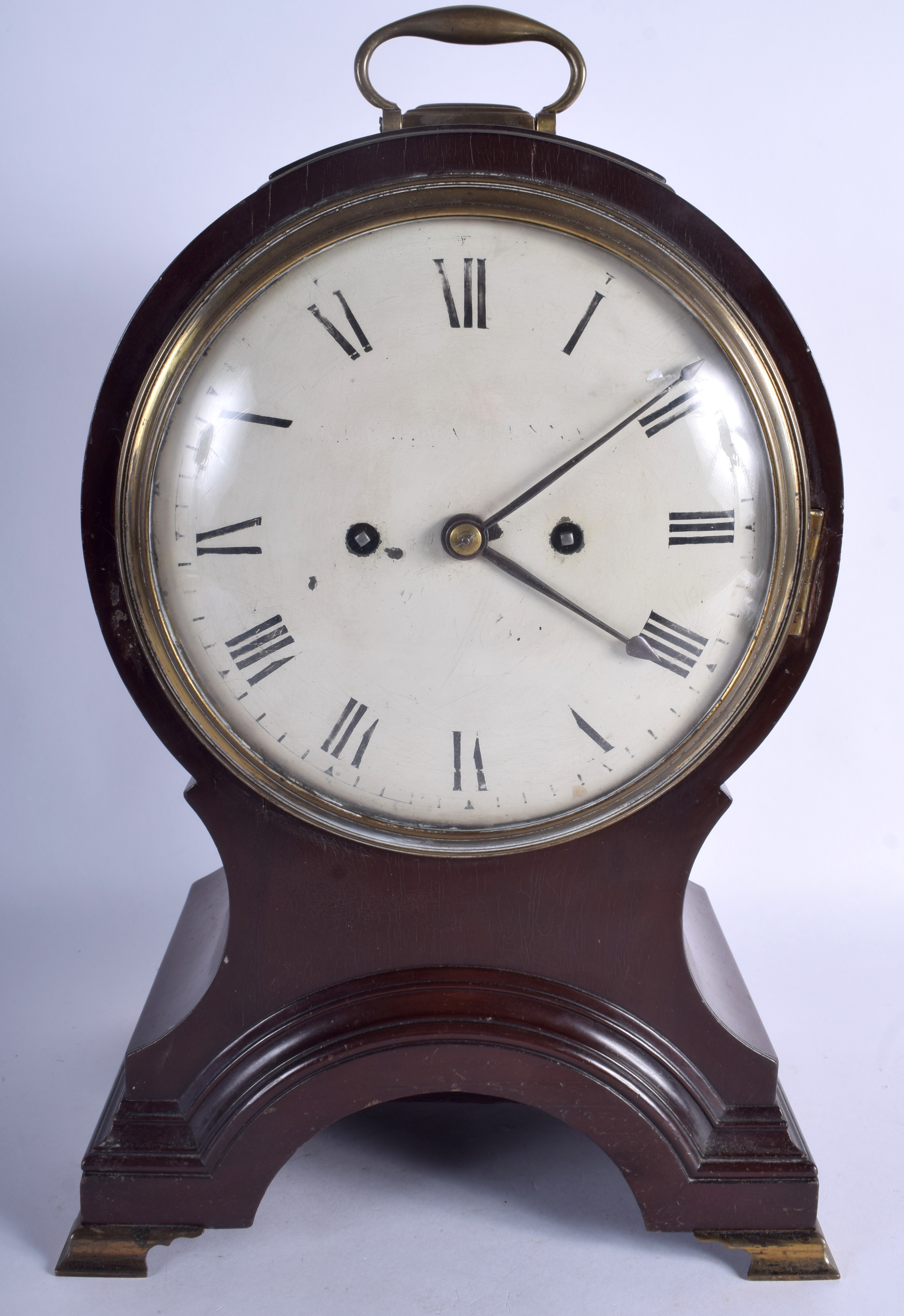 A WILLIAM IV MAHOGANY BALLOON SHAPED MANTEL CLOCK with large circular dial and brass feet. 43 cm hi