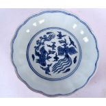 A CHINESE MING STYLE BLUE AND WHITE PORCELAIN DISH BEARING XUANDE MARKS, decorated with the phoenix