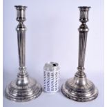 A PAIR OF ANTIQUE BREMS VARAIN SAARBRUCKEN SILVER CANDLESTICKS with acanthus banding. 124 oz (loade