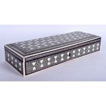 A 19TH CENTURY ANGLO INDIAN IVORY RECTANGULAR BOX decorated with star shaped motifs. 28 cm x 10 cm.