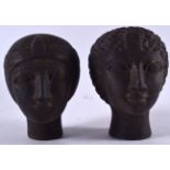 A PAIR OF HEAVY EGYPTIAN CARVED STONE HEAD SCULPTURE, each weighing approx 2 kg. 15 cm x 13 cm.