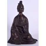 A CHINESE IRON STATUE OF GUANYIN, modelled seated with serene expression. 26 cm high.