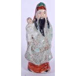 AN EARLY 20TH CENTURY CHINESE FAMILLE ROSE PORCELAIN FIGURINE OF A STANDING SCHOLAR, modelled in fl