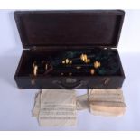 A VINTAGE SET OF SCOTTISH BAGPIPES within a wooden carrying case. (qty)