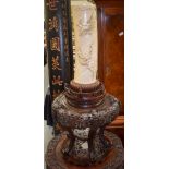 A VERY LARGE 19TH CENTURY JAPANESE MEIJI PERIOD CARVED IVORY DRAGON TUSK VASE upon a hardwood stand