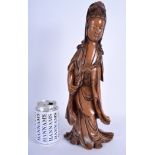 A LARGE 19TH CENTURY CHINESE CARVED WOOD FIGURE OF GUANYIN modelled holding in flowing robes. 39 cm