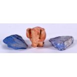 AN EASTERN POTTERY ELEPHANT, together with two pieces of lapis. Elephant 4 cm wide. (3)