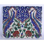 A LARGE TURKISH MIDDLE EASTERN IZNIK FAIENCE TILE painted with flowers. 32 cm x 26 cm,.