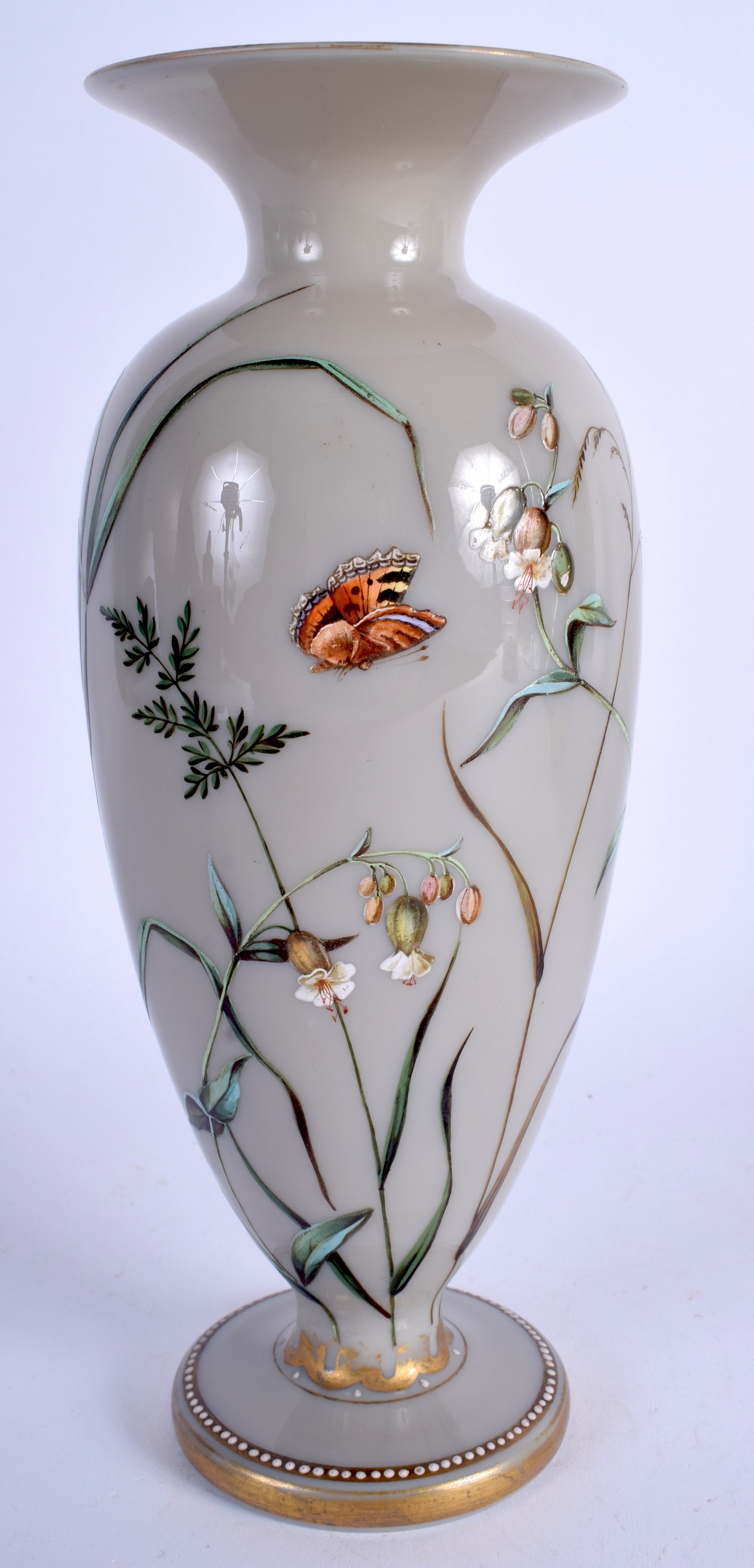 A VICTORIAN GREY OPALINE ENAMELLED GLASS VASE painted with a moth over foliage. 23.5 cm high.