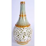 AN ANTIQUE ROYAL WORCESTER RETICULATED PORCELAIN VASE in the manner of George Owen. 14 cm high.