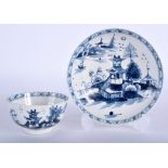 A 18TH CENTURY LOWESTOFT TEA BOWL AND SAUCER painted with a two story pagoda in blue. (2)
