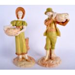 A ROYAL WORCESTER PAIR OF FIGURES OF A BOY AND GIRL, wearing hats and holding baskets decorated in