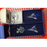 A GROUP OF BOXED SWAROVSKI FIGURINES OF VARYING FORM, including a polar bear. (qty)