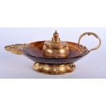 A 19TH CENTURY FRENCH CARVED AGATE GILT METAL GENIE LAMP INKWELL decorated with foliage. 14 cm wide
