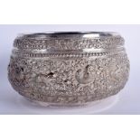 A 19TH CENTURY INDIAN SILVER BUDDHISTIC REPOUSSE BOWL probably Kutch, decorated with figures within