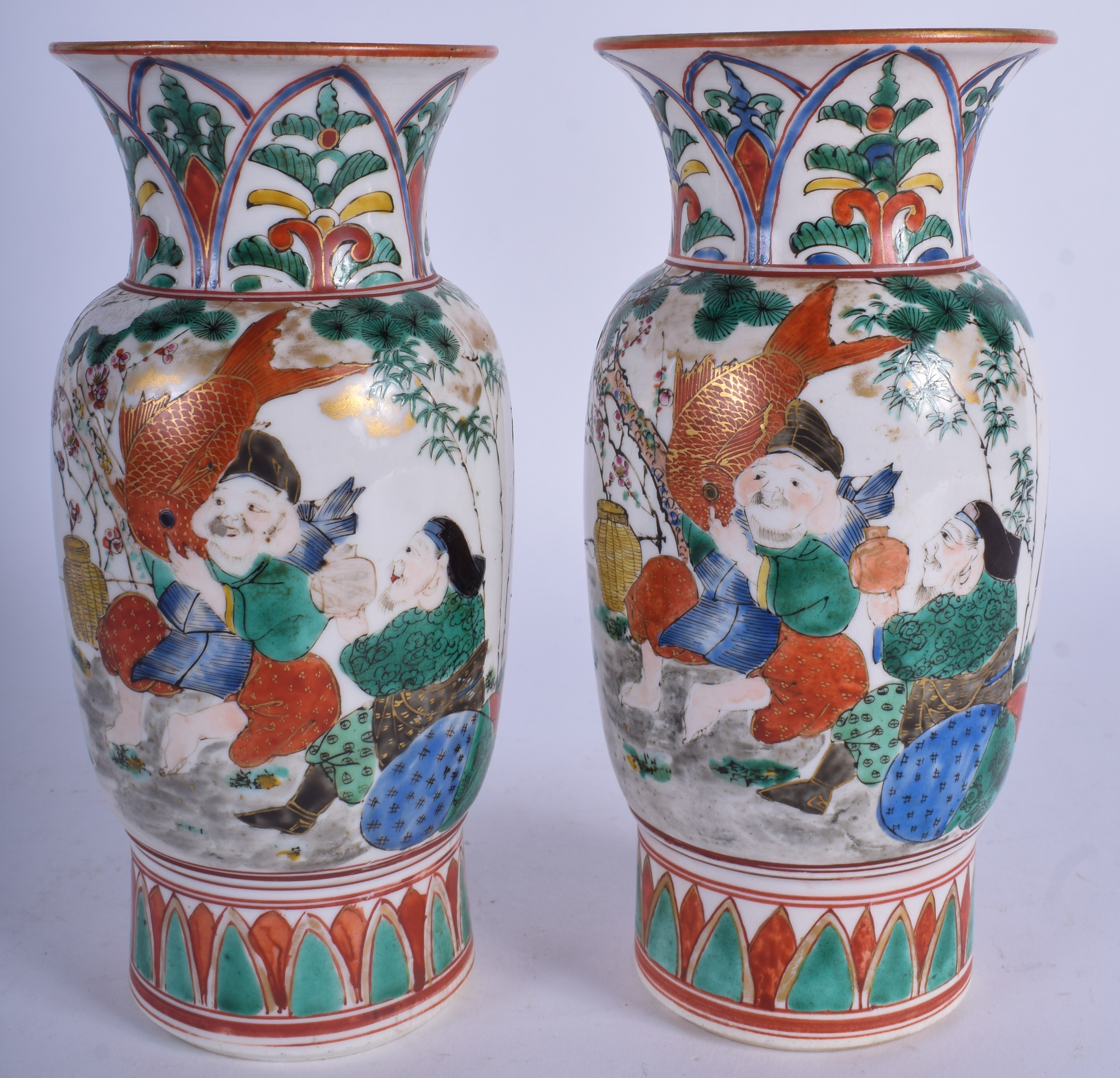 A PAIR OF 19TH CENTURY JAPANESE MEIJI PERIOD KUTANI VASES painted with figures. 19 cm high.