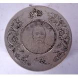 A CHINESE WHITE METAL CIRCULAR BOX, inset with a coin. 7.5 cm wide.