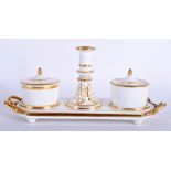 AN EARLY 19TH CENTURY DERBY INKSTAND with two ink pots and a taper stick on stand. Ink pots 12 cm h