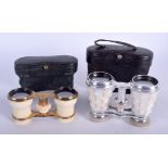 A PAIR OF ANTIQUE IVORY OPERA GLASSES together with a pair of mother of pearl opera glasses. 10 cm