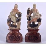 A PAIR OF 19TH CENTURY CHINESE CARVED SOAPSTONE FIGURES. 20 cm x 8 cm.