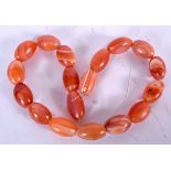 AN AGATE NECKLACE, formed with egg shaped beads. 40 cm long.