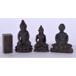 A SMALL CHINESE BRONZE SEAL, together with three buddha. Largest 3.6 cm high. (4)