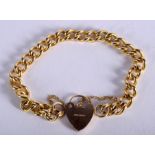 A 9CT GOLD BRACELET with 9ct gold locket. 21.2 grams.
