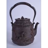 A 19TH CENTURY JAPANESE EDO PERIOD CAST IRON AND BRONZE TETSUBIN TEAPOT decorated with figures. 17