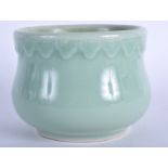 AN EARLY 20TH CENTURY CHINESE CELADON CENSER with moulded decoration. 11 cm wide.