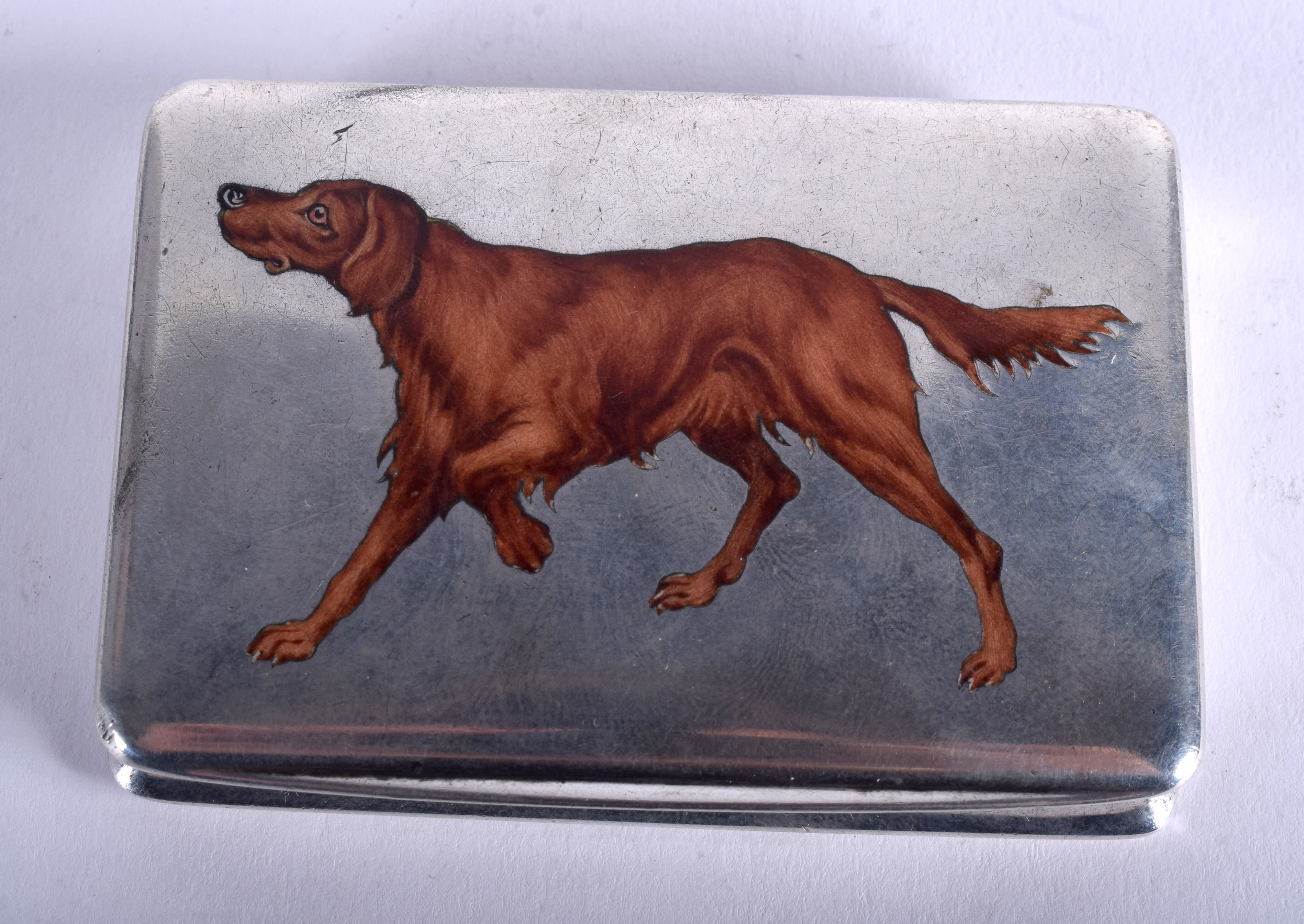 AN ART DECO CONTINENTAL SILVER AND ENAMEL SNUFF BOX painted with a dog. 2.4 oz. 7.5 cm x 5.5 cm.