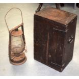 A VINTAGE IRON BOUND CABINET together with a tilly lamp. Cabinet 45 cm x 27 cm. (2)