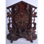 AN ANTIQUE BLACK FOREST BAVARIAN MANTEL CLOCK carved with berries and leaves. 45 cm x 32 cm.