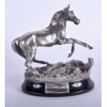 A MODERN SILVER FIGURE OF A HORSE modelled upon an ebonised base. 10 cm x 12 cm.