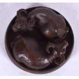 A CHINESE BRONZE FIGURE OF TWO SLEEPING OXON, bearing Yin & Yang symbol to base. 5 cm wide.