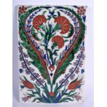 A MIDDLE EASTERN IZNIK FAIENCE POTTERY TILE painted with floral sprays. 16 cm x 23 cm.