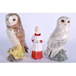 TWO ROYAL DOULTON OWL WHISKEY DECANTERS together with a Doulton choir boy. (3)