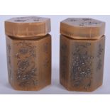 A VERY RARE PAIR OF 19TH CENTURY CHINESE CARVED RHINOCEROS HORN MEDICINE JARS decorated with silver