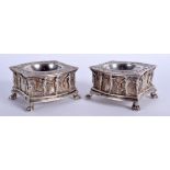 A FINE RARE PAIR OF 18TH CENTURY CONTINENTAL ARMORIAL SILVER SALTS of lovely quality, decorated wit