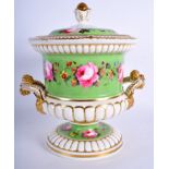 A ENGLISH PORCELAIN CAMPANA VASE AND COVER with pot pourri inner liner painted with roses on a gree