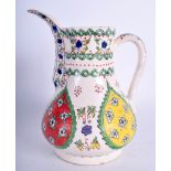 A MIDDLE EASTERN TURKISH KUTAHYA FAIENCE COFFEE POT painted with floral sprays. 18 cm high.