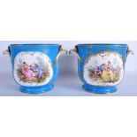 A PAIR OF 18TH CENTURY FRENCH SEVRES PORCELAIN TWIN HANDLED CACHE POTS painted with lovers within l