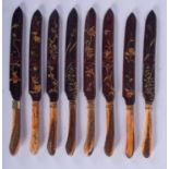 A SET OF EIGHT 19TH CENTURY JAPANESE MEIJI PERIOD STAG ANTLER LACQUER KNIVES. (8)