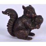 A JAPANESE BRONZE OKIMONO IN THE FORM OF A SQUIRREL, modelled holding his nuts, signed. 4.6 cm wide